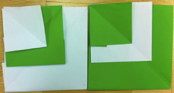 Grønne og hvite papirbrettfigurer