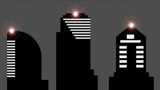 Tre skyskrapere med lys på taket.